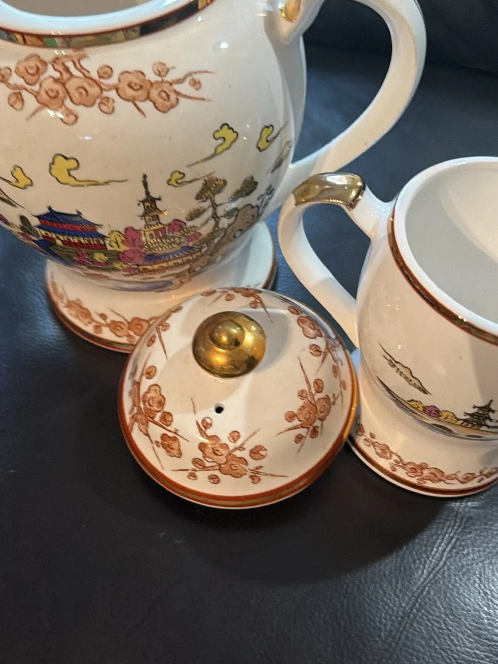 White Ceramic Tea Set with Gold Trim and Oriental Scenic Design